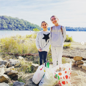Love Your Waterways Instagram competition winning photo shows two girls picking up litter by the Georges River