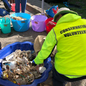 Volunteers sort litter for a litter audit on the Georges River