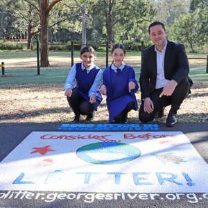 Mayor El-Hayek from City of Canterbury Bankstown with students from St Mary's Primary School Georges Hall with the finished artworks
