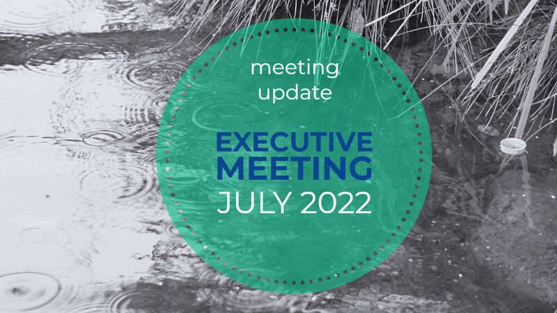Graphic for July Executive Meeting with black and white image showing raindrops on water