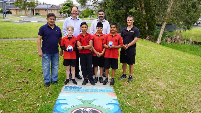Students from Sarah Redfern Public School with (L-R) Georges Riverkeeper representatives including Campbelltown Councillor Rey Manoto and Scott Reyes, Campbelltown City Council Mayor George Greiss and Campbelltown City Councillor Matt Stellino