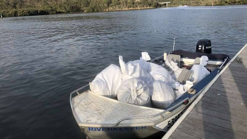 Georges Riverkeeper boat with full litter collection bags