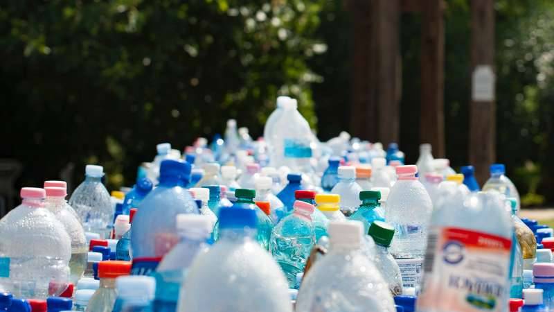 A group of plastic bottles collected to be returned for money as part of the Container Deposit Scheme in NSW otherwise known as Return and Earn.