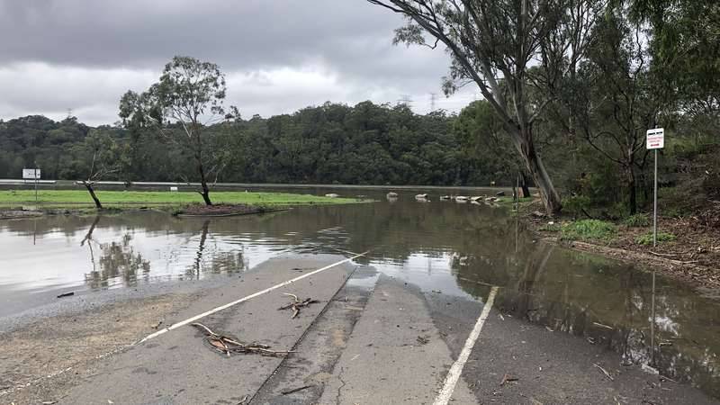 Georges River flooding into carpark at Georges River National Park