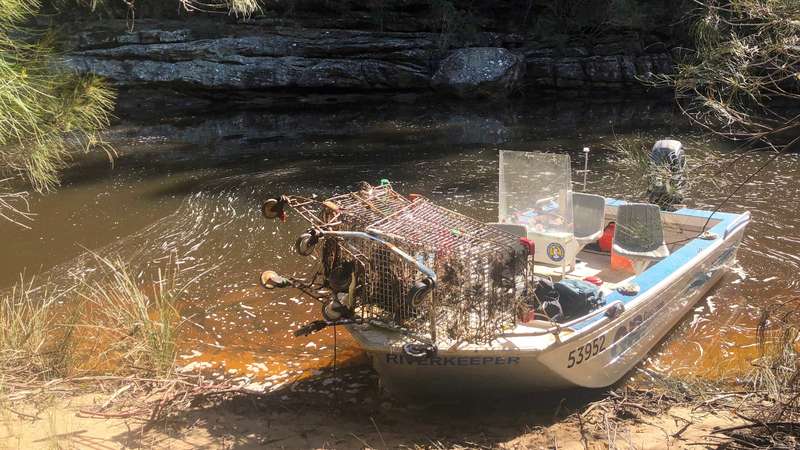 removing shopping trolleys from The Needles along the Woronora River in Engadine