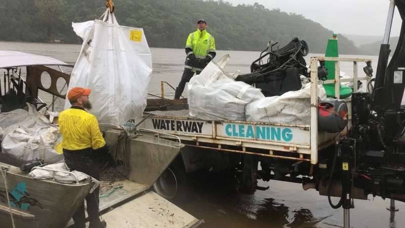 Ocean Crusaders on the Georges River with Georges Riverkeeper using heavy equipment to remove rubbish and debris